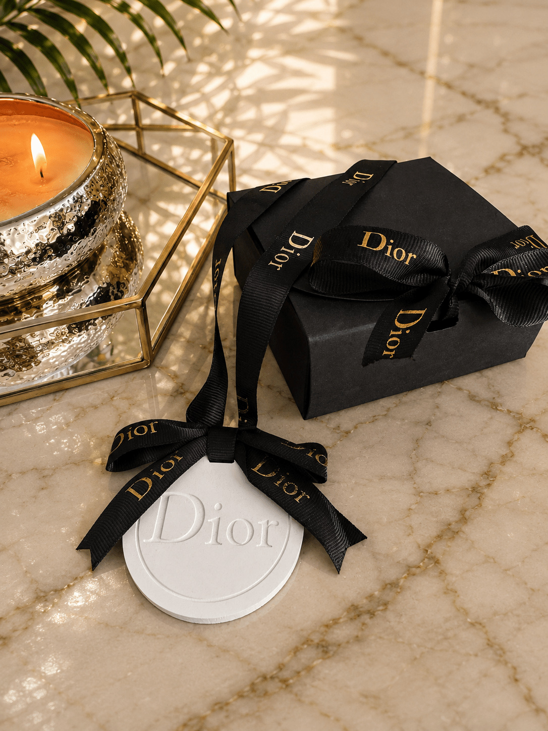 An elegant black and white hanging air freshener that doubles as a luxury car accessory and home fragrance. Perfect for everyday use or gifting, this designer - inspired scent accessory adds sophistication to any space. - Aura & Aroma